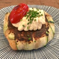 Summer trinxat (typical potato mash) with hot kimchi mayo and a charred cherry tomato.
This dish was delicious. It's basically mashed potatoes wrapped in zucchini and baked/seared to make it look like a baked potato haha. It was perfectly seasoned and the kimchi mayo and charred cherry tomato worked great with it. If you're a fan of potatoes (like me) you'll love this. at Rasoterra in Barcelona