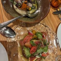 Our starters: Pumpking with pea purée and tomato fig saladd  at Rasoterra in Barcelona