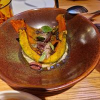 Red kury PUMPKIN, ganxet bean cream, kalamata olive crumble, dried leek powder (gf) at Rasoterra in Barcelona