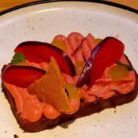 Prune SPONGE, black plum cream, oil emulsion, cornet at Rasoterra in Barcelona