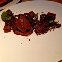 Preserved CHERRIES, home-made chocolate and cardamom ice-cream, grounds’ crumble and sponge, ron caramel (gf) at Rasoterra in Barcelona