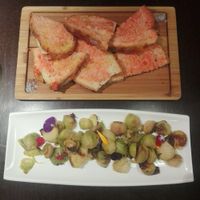 Seasonal brussel sprouts with home made bread and fresh tomatos at Rasoterra in Barcelona