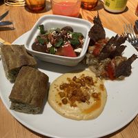 Fig, tomato and ‘feta’ tofu salad, focaccia, hummus and smoked eggplant. Amazing!   at Rasoterra in Barcelona