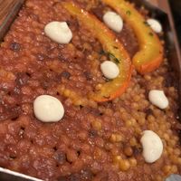 Paella de FREGOLA (pasta de Sardenya), carbassa potimarron rostida i veganesa de tomàquet confit  at Rasoterra in Barcelona