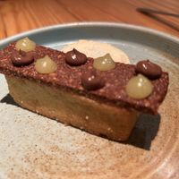 Oda a l’OLI EXTRA VERGE d’OLIVA (pa de pessic, gelat i emulsió), xocolata, avellanes  at Rasoterra in Barcelona