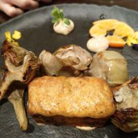 Marinated artichokes, pumpkin and horn of plenty mushroom spongy cake at Rasoterra in Barcelona