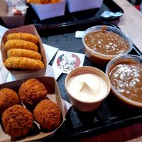 Bitterballen, cheesy rings, mayonaise and stoofvleessaus at Pepas Vegan Frituur in Leuven