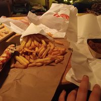 Take out fries with avocado bites and vegan frikandel special at Pepas Vegan Frituur in Leuven