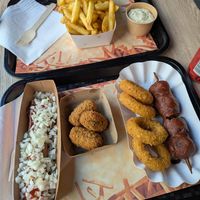 small fries with homemade tartar sauce, frikandel speciaal, forest mushroom croquettes, cheezz rings & grizzly (batter-fried meatball & onion saté) at Pepas Vegan Frituur in Leuven