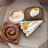 Caramel apple sticky bun, pistachio olive cake, lemon tart, and lemon almond oil cake.   at Orange & Blossom Patisserie in Portland