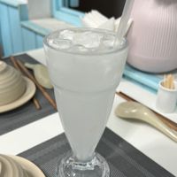 Coconut water with coconut junks and ice - so refreshing   at An Nhi Chay in Hue