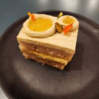 Cardi P: coconut sponge, pistachio cardamom buttercream, Yuja marmalade, pistachios at Paper Cake Shop in Seattle