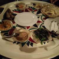 Bottom:Yellow lentil dip, foul, vine leaves with rice at Abou El Sid Restaurant in Cairo