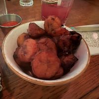 Fried plantain with spicy tomato sauce  at Jungle Palace Restaurant - Ephemera in Paris