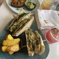 Vegan club sandwich from the snack menu and sweet potato from the main menu   at The Queen's Picturehouse & Eatery in 