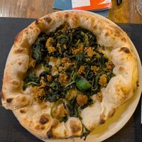 Greens and vegan sausage pizza at Mercato Pompeiano Restaurant in Pompei