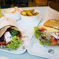 Seitan Pastrami Wrap with vegan feta; Burger with tofu and vegan cheese at Krowarzywa - Hoza in Warsaw