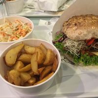 Burger with salad and potatoes yum! at Krowarzywa - Hoza in Warsaw