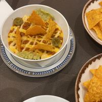 Vegan nachos with an extra plate of nachos to dip   at Veganapati in Lisbon