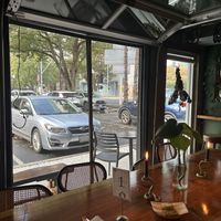 I dude with garage doors open   at Immortal Cafe & Supply in Sacramento