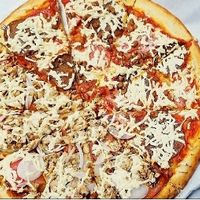 Large, half meat lover and BBQ chicken pizza at Vegan Pizza in Garden Grove