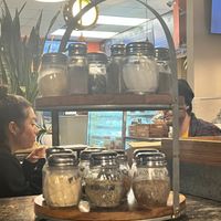 all kinds of stuff to sprinkle at Vegan Pizza in Garden Grove