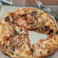 Meat Lovers pizza (missing a few bites) at Vegan Pizza in Garden Grove
