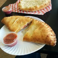 Pepperoni and cheese calzone with garlic cheezy breadsticks at Vegan Pizza in Garden Grove