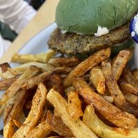 Homemade burger with spinach bun and vegan tartar sauce.  at Skapto  in Sofia