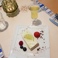 Citroen bavarois met cacaonibs. Erbij een glas limoncello at Veggies on Fire in The Hague