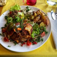 Meditterean-inspired beetrot seitan with rosemary potatoes at Veggies on Fire in The Hague