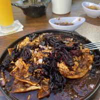 Chilaquiles rojos veganos con flor de jamaica   at Mobula Sea Cafe in La Paz