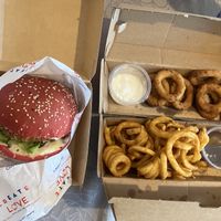 Chicken sandwich, curly fries, onion rings   at Vegan Pirates by CloudEatery in Berlin