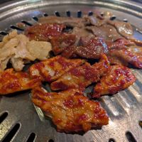 Assorted meats on the table grill at Master Kim's Korean BBQ 2 in Las Vegas