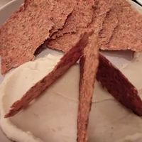 Kimchi crackers with white bean hummus at Bar Avelo in Toronto