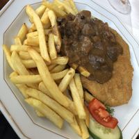 „Schnitzel“ with french fries and mushroom cream Sauce  at Die Weinstube Nachhaltig Geniessen in Zeltingen