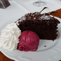 Chocolate cake, whipped cream and ice cream at Die Weinstube Nachhaltig Geniessen in Zeltingen
