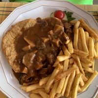 Schnitzel with mushroom sauce  at Die Weinstube Nachhaltig Geniessen in Zeltingen