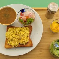 Vegan egg scramble on toast, lentil soup, quinoa salad, mango chia pudding, and an iced matcha latte! at The Kind  in Kyoto