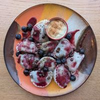 Fantastic blueberry pierogi with vanilla oat yoghurt, fresh blueberries, blueberry jam, and chocolate drops at Kemuri in Reykjavik