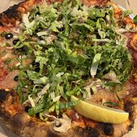 The vegan pizza was the worst thing we ordered. Romaine lettuce over dry toppings and weird cheese. Nice crust, though.  at Left Field Brewery in Toronto