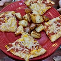 Cheese pizza and roasted potatoes  at The Grain Cafe in Los Angeles