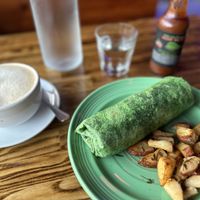 Breakfast burrito and chai lattee  at The Grain Cafe in Los Angeles
