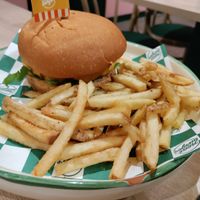 The burger comes with fries at Neat Burger - Merlata Bloom in Milan