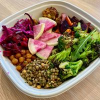 Build your own bowl with herbed lentils, crispy chickpeas, citrus pickled cabbage, watermelon radish, cauli samosa, vinaigrette roasted broccoli and more! at Rooted3 in Bethesda