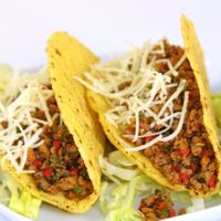 Tortillas de maíz relleno con carne molida de soya y queso vegano. Ensalada verde.  at Govindas in Santa Marta