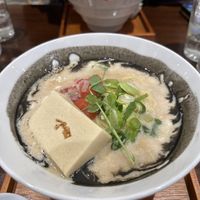 The black rim is a black seasame sauce   at MOON and BACK in Kyoto