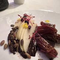 Dessert of vanilla infused dates and sliced pears with pepitas and dark chocolate.    at Restaurant Beck in Depoe Bay