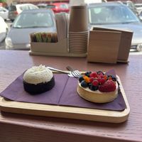 Coconut cake and fruit cake with lemony custars inside   at Julietta Pastry and Lab in Rome