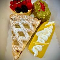 Our choices: cream and berries tart, pistacchio and raspberry semifreddo, coconut and mango semifreddo, ricotta and visciole tart at Julietta Pastry and Lab in Rome